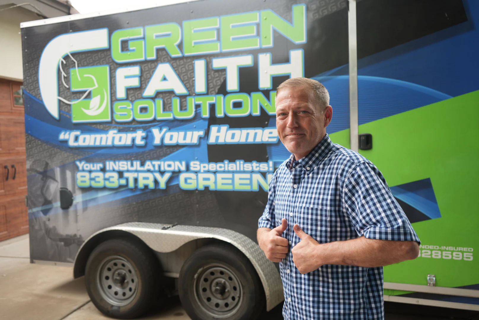 A local Green Faith Solutions owner overseeing an attic insulation project